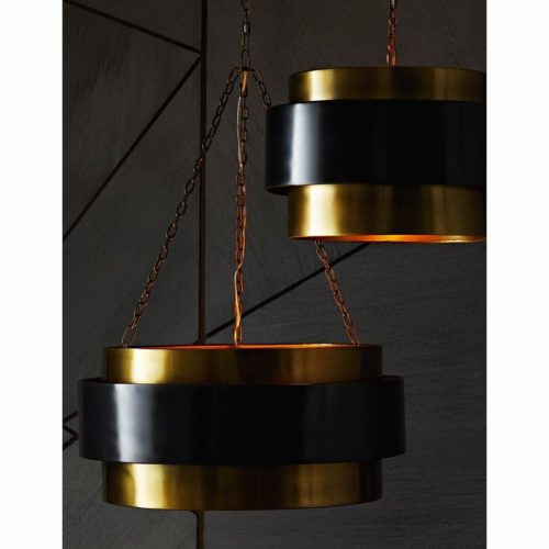 This iron, mid-century-inspired, one-light vintage brass-finished pendant is the perfect light to hang over your dining table.The dark bronze floating band adds contrast and dimensionality to the simple elegant design.