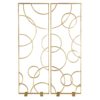Brilliant as a room screen or as decor against an expansive wall, this modern piece solves a variety of design issues. The rectangular iron panel is entirely finished with gold leaf and frames a geometric overlay ofintersecting circles. There’s no way you can have a bad day with this shiny and bubbly piece around.
