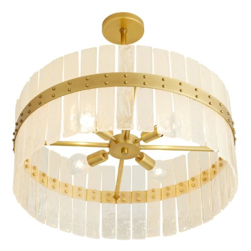 This timeless chandelier has a beauty all its own. Constructed of over twenty panels of organic seeded glass, each is formed by hand, so they will feature their own individual forms and naturaledges. The outer steel band shines in an antique brass finish, with rivet details that offer an unexpected edge to the refined aesthetic