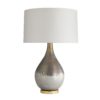 Mercury glass has been used for centuries to create traditional décor pieces. This table lamp features a satin silvered bronze finish that’s matte and distressed to give it a handsome, aged look. The process naturally creates drip textures thatmake it even more spectacular—when switched on, it has a rainbow-like iridescent sheen.
