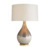 Mercury glass has been used for centuries to create traditional décor pieces. This table lamp features a satin silvered bronze finish that’s matte and distressed to give it a handsome, aged look. The process naturally creates drip textures thatmake it even more spectacular—when switched on, it has a rainbow-like iridescent sheen.