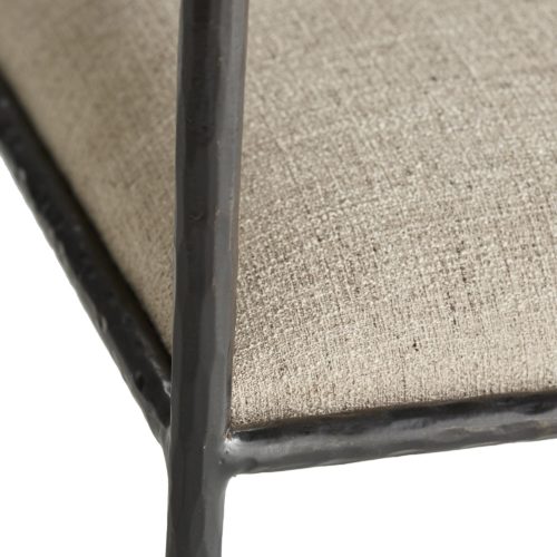 This exquisite frame is perfectly poised, perched on delicate legs that are as faint as insects'. The natural iron body has been hand-forged, yielding soft impressions along the sharp-angled frame. The tight seat and bolster back cushion are coveredin a textured pewter poly-blend fabric.