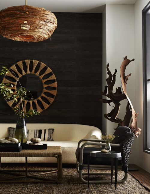 modern living room featuring black marble accent table with natural accents of driftwood sculpture, and organic hues of earth tones. Beautiful way to express your global inspired living space.