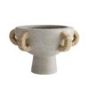 Terracotta is molded into an almost kylix-shaped piece and finished in fossil gray before being fashioned with fiveabaca-wrapped handles. A stylish and sturdy option for centering a tablescape indoors or in covered outdoor areas.