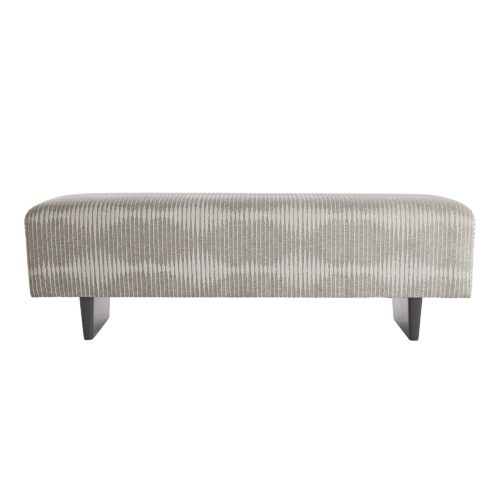 Captivating and luxurious fabrics inspire this design, built to accommodate the textural patterns in this elegant cloth. The bench is wrapped almost entirely in the fabric, with a nearly perfect cut that creates a seamless look in the fabric atevery angle. It rests on grey ash finished sled legs made from solid maple wood.