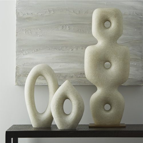 Crafted from rice-stone, the expressive form of sculptural art takes shape in this well-formed trio. Showcasing a profile that recalls mid-century modern design, the sleekness of this varied-height sculptured set works well to curate a tabletop gallery. Finish may vary.