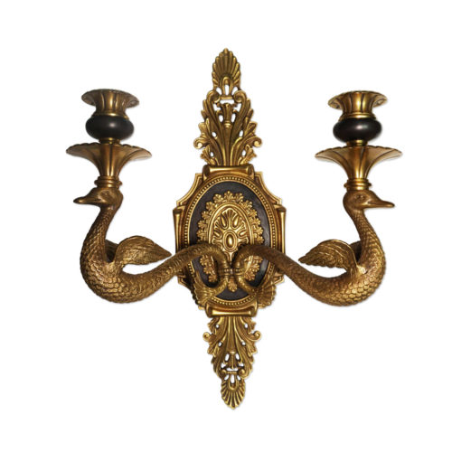Elegant candle sconce made of solid brass featuring two intricately detailed swans.