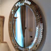Oval Venetian Mirror with running coin and amber border